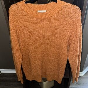 For the Republic Sweater in a orange brown color
